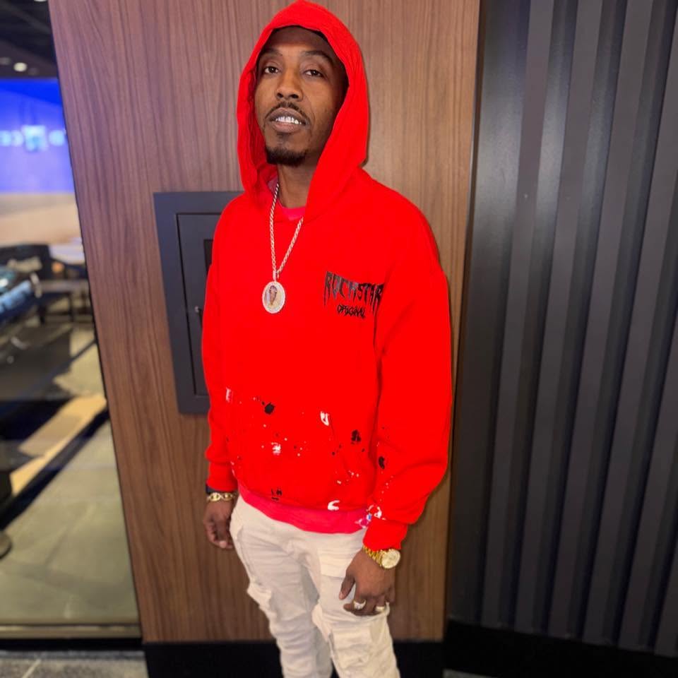 Kutta Da General in a red hoodie